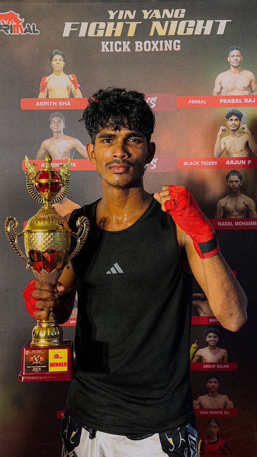 Black Tigers fighter with trophy at Yin Yang Fight Night kickboxing